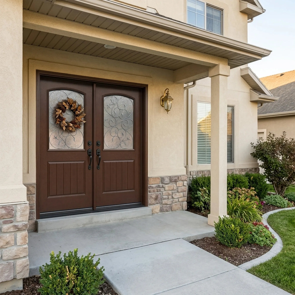 Brown fiberglass front entry double door installed on home exterior