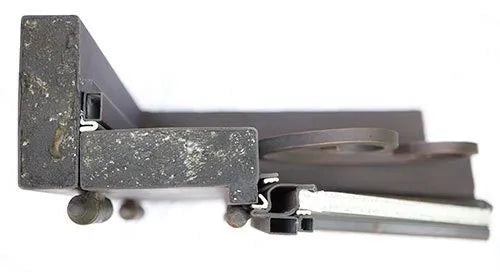 Close-up of top section of black iron door frame highlighting heavy-duty steel construction and finish