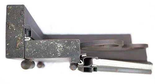 Close-up of top iron door frame showing heavy-duty steel construction and black finish on double entry
