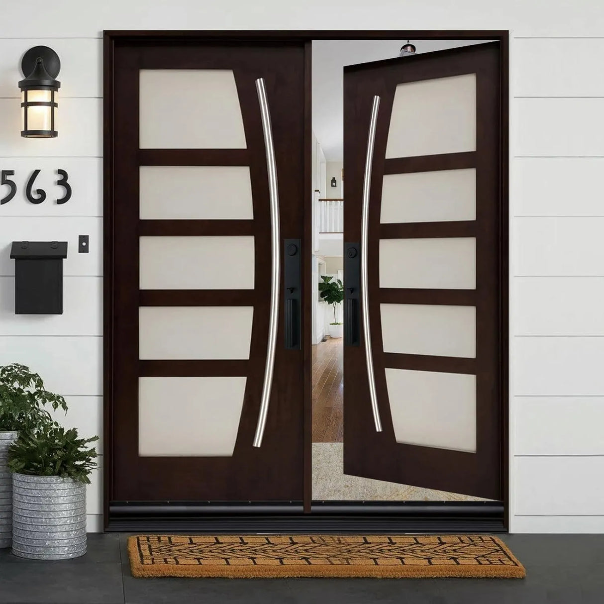 Double front entry door shown in right-hand inswing configuration with decorative glass panels