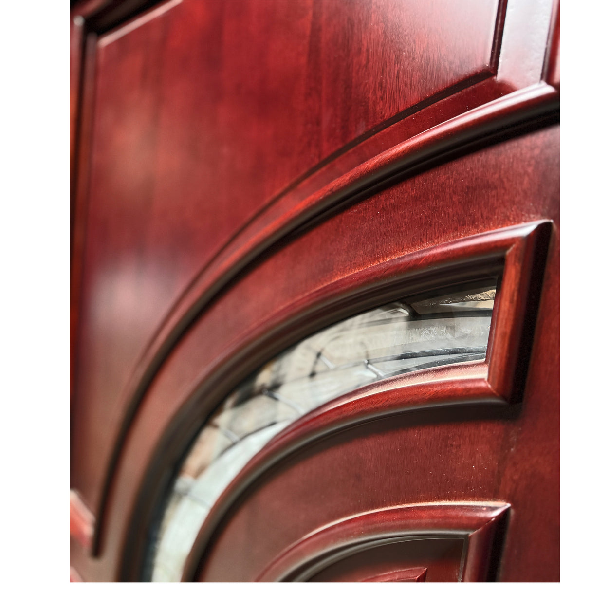 Detailed view of crescent-shaped glass panels highlighting curved design and texture