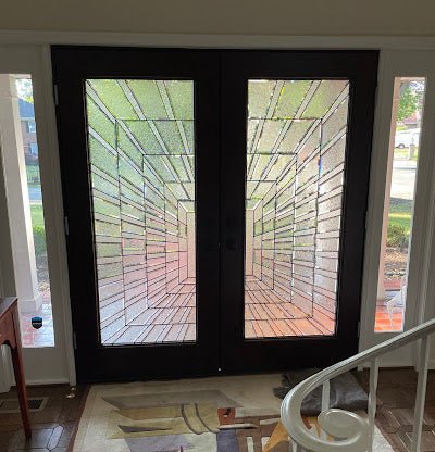 Modern front entry door with clean lines and glass panels