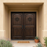Solid wood double front entry door installed on home exterior with apeakeasy design