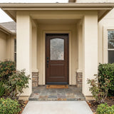Brown fiberglass front entry door installed on home exterior