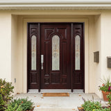 Solid wood front entry door with sidelights installed on home exterior featuring decorative beveled glass panels
