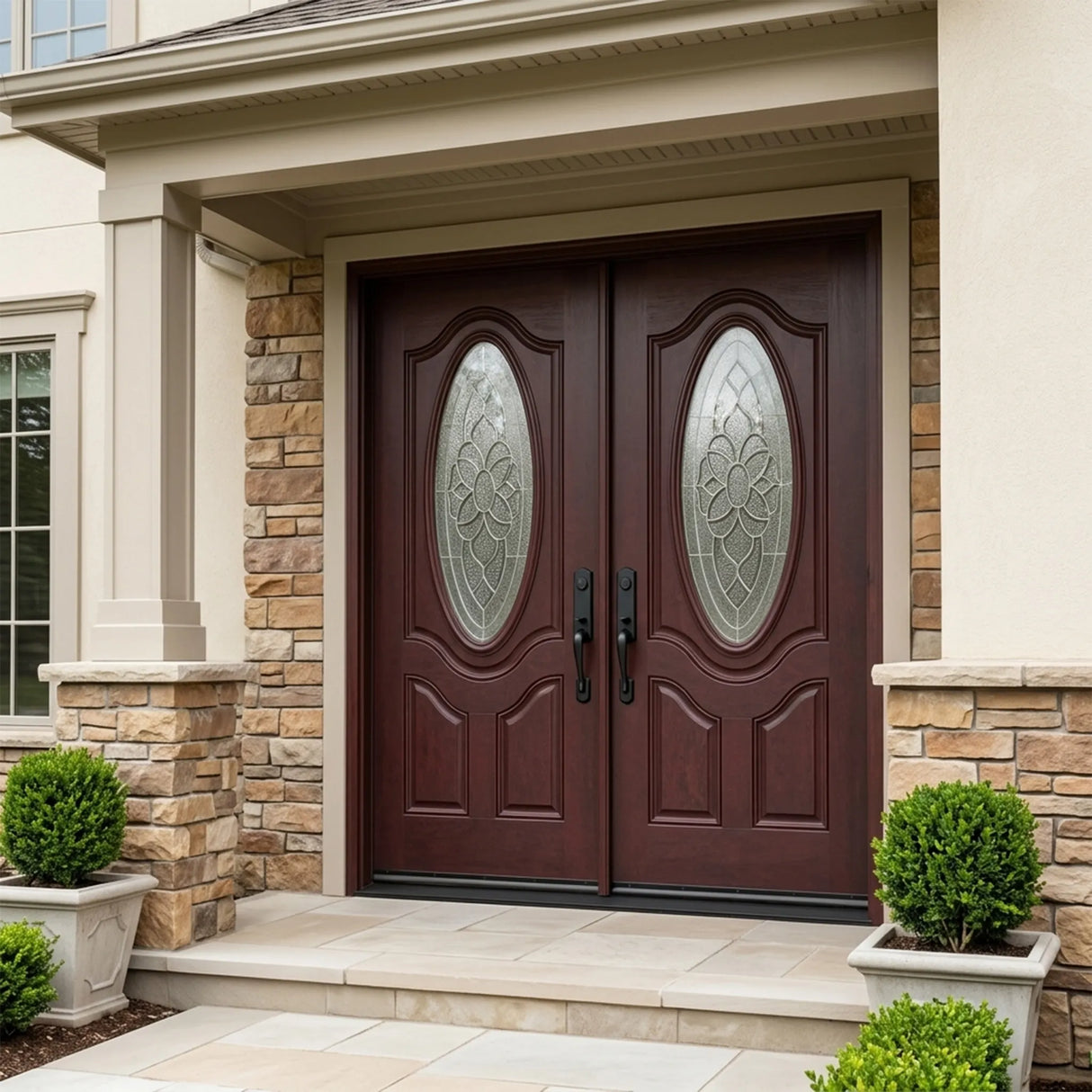 Fiberglass double front entry door installed on home exterior with decorative oval beveled glass panels