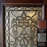 Close-up of decorative wrought iron and privacy glass insert on solid wood front entry door showing ornamental scrollwork