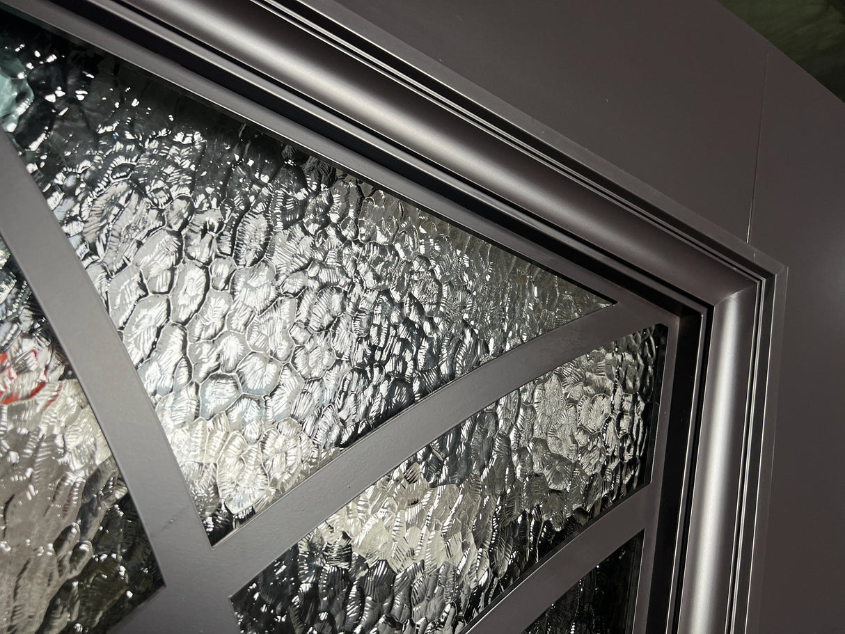 Close-up of decorative glass and iron frame detail on double front entry door