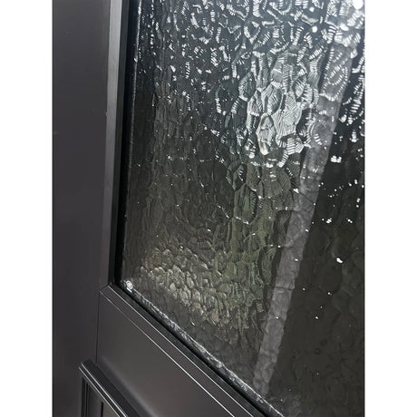 Close-up of textured glass panel on iron double front entry door with black metal grid
