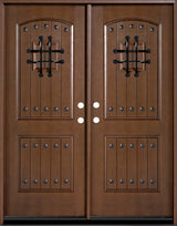 Fiberglass double front entry door with decorative speakeasy glass panels and wood grain finish, straight-on view