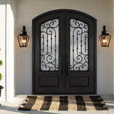 Black arched double iron front door with decorative glass panels