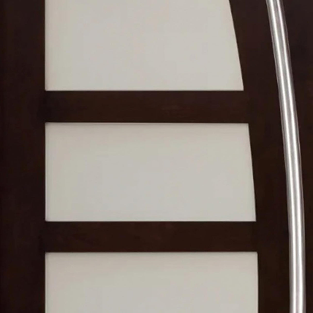 Close-up of decorative glass panel on entry door showing textured design and privacy detail