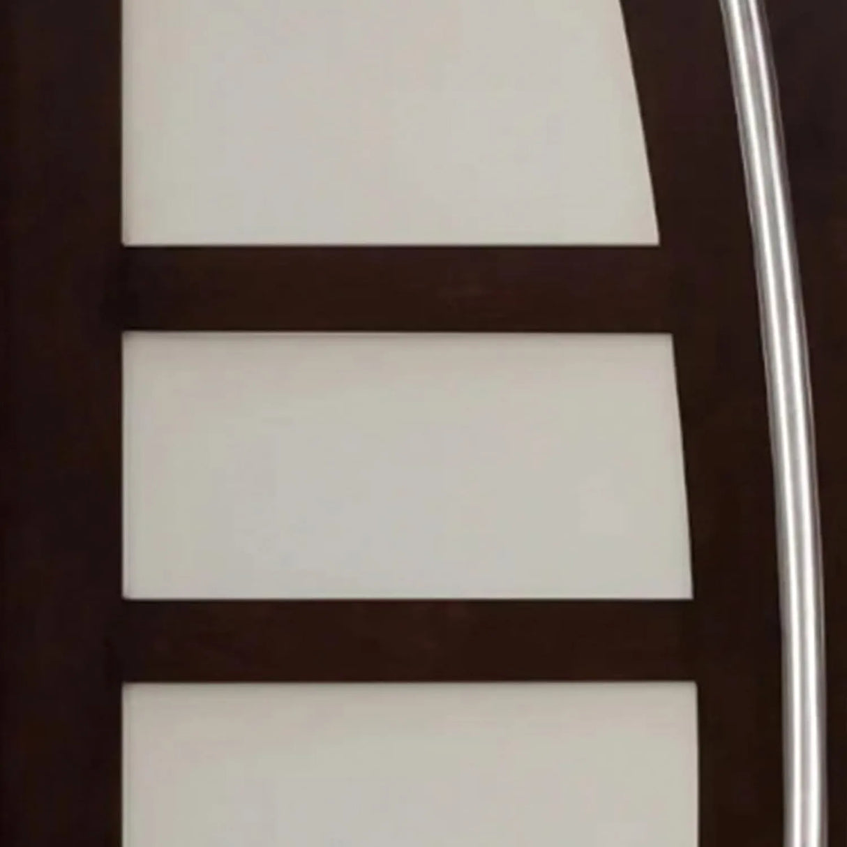 Close-up of decorative glass panel on entry door showing textured design and privacy detail