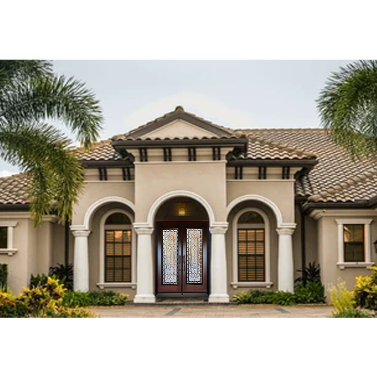 Double front entry door installed on home exterior with decorative glass panels and traditional styling