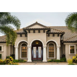 Double front entry door installed on home exterior with decorative glass panels and traditional styling