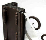 Detailed top section of iron double door showing glass panel integration within steel frame design