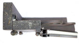 Close-up of top section of black iron door frame highlighting heavy-duty steel construction and finish