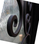 Close-up detail of textured rain glass panel on black iron front door showing privacy glass design and steel framing